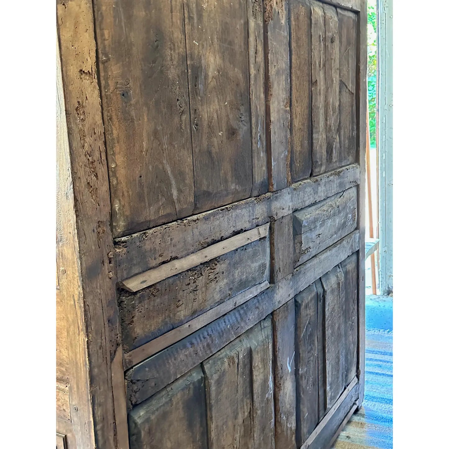 Rustic wooden door with a textured surface