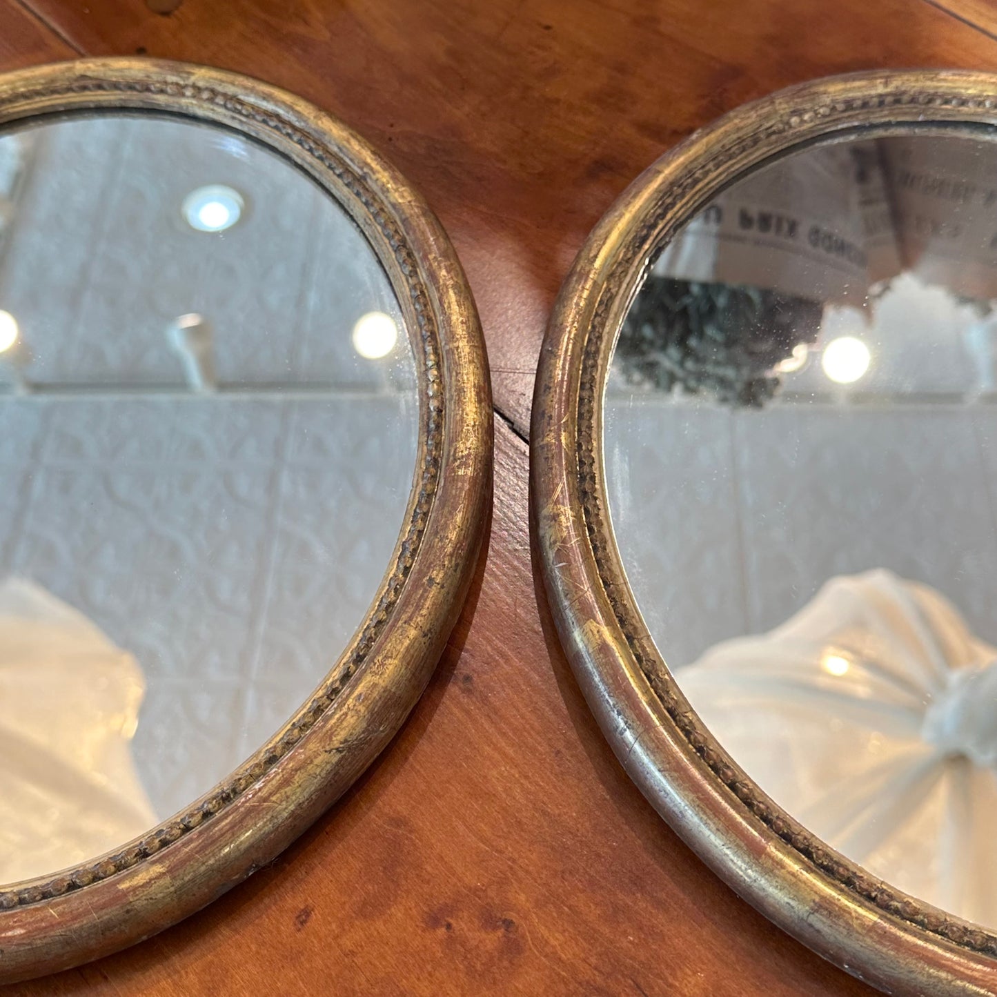 Small 18th C gilded oval mirrors- new glass