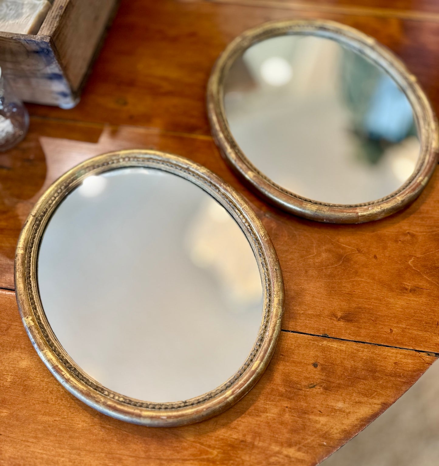 Small 18th C gilded oval mirrors- new glass