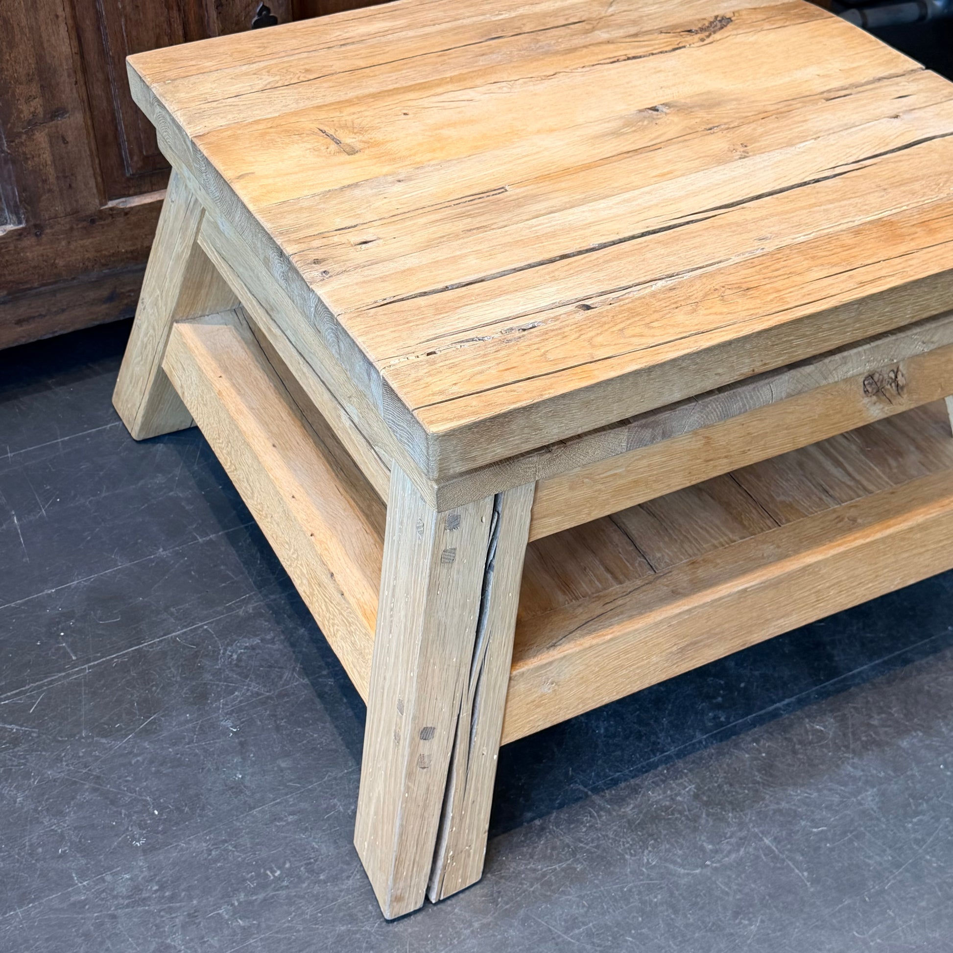Wooden step stool on a dark floor
