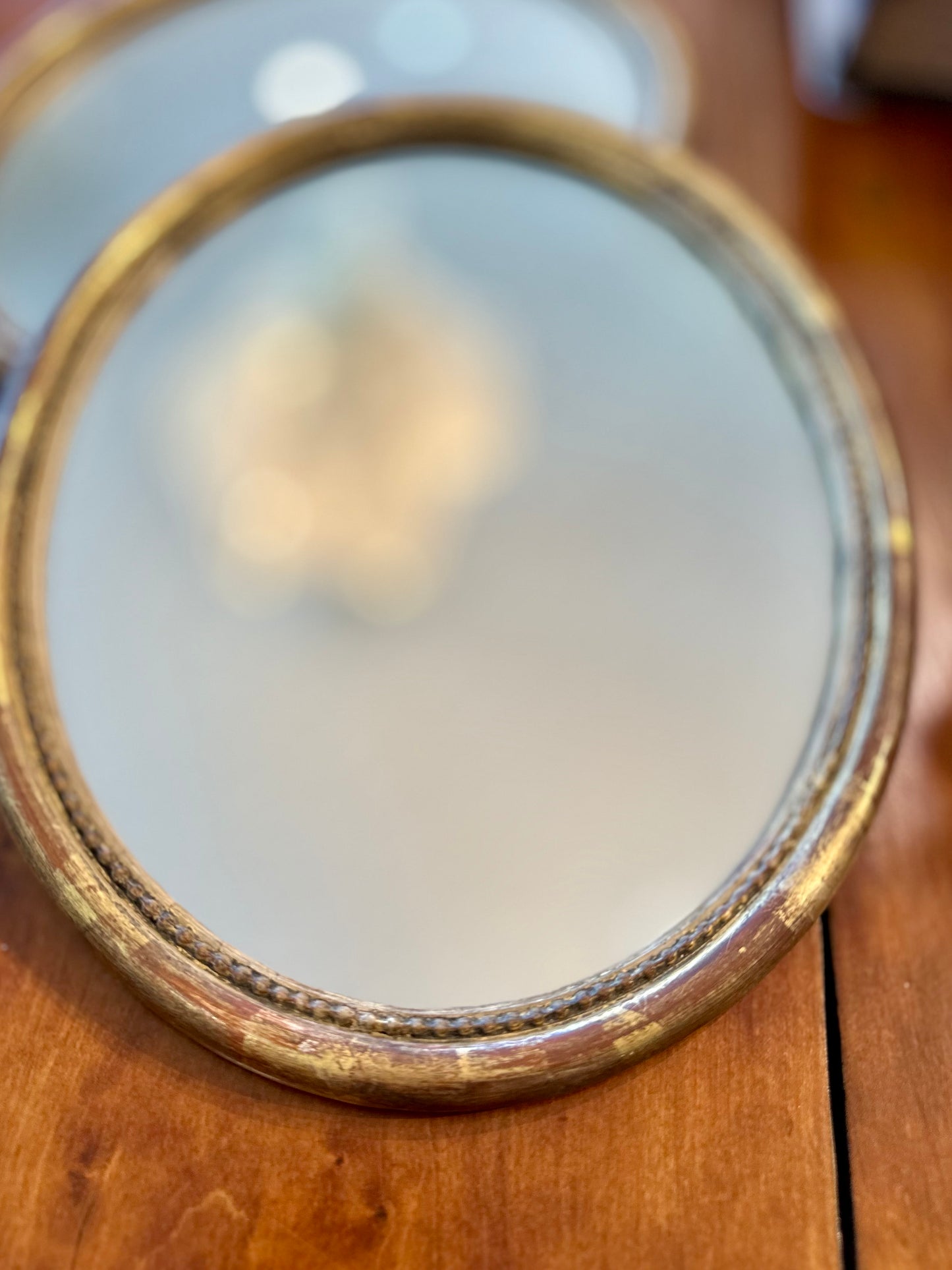 Small 18th C gilded oval mirrors- new glass