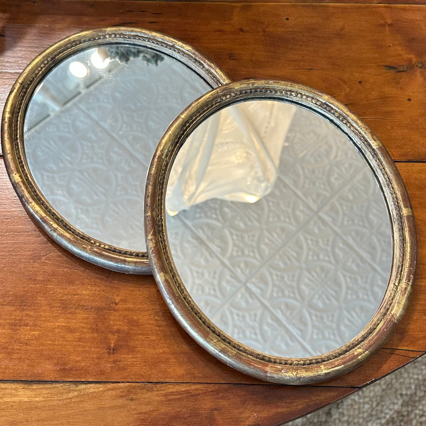 Small 18th C gilded oval mirrors- new glass