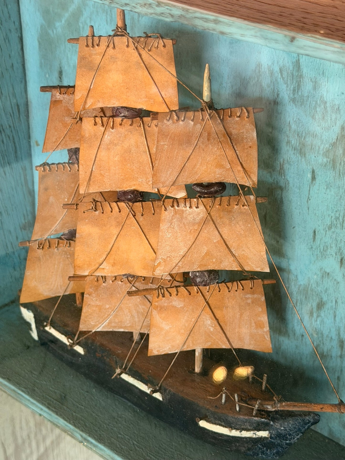 Primitive Model Ship in Shadow Box