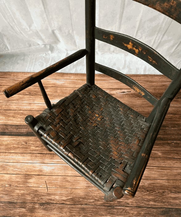 Early 19th Century Early American Ladder Back Arm Chair in Old Black Paint
